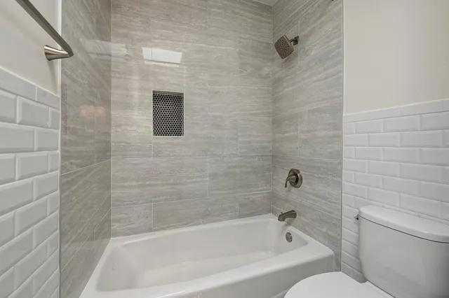 a view of a backyard with a large tree