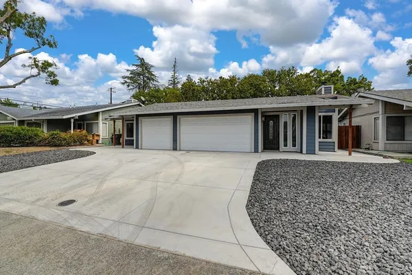 a kitchen with stainless steel appliances kitchen island granite countertop a sink and cabinets