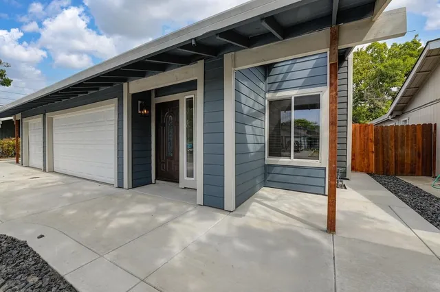 a kitchen with stainless steel appliances granite countertop a stove and a refrigerator