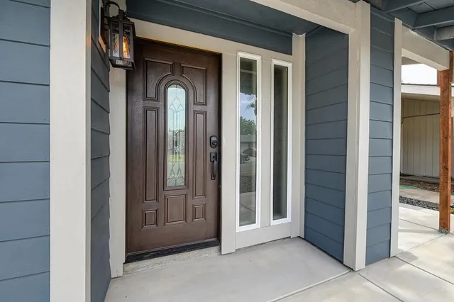 a metallic refrigerator freezer sitting in a kitchen