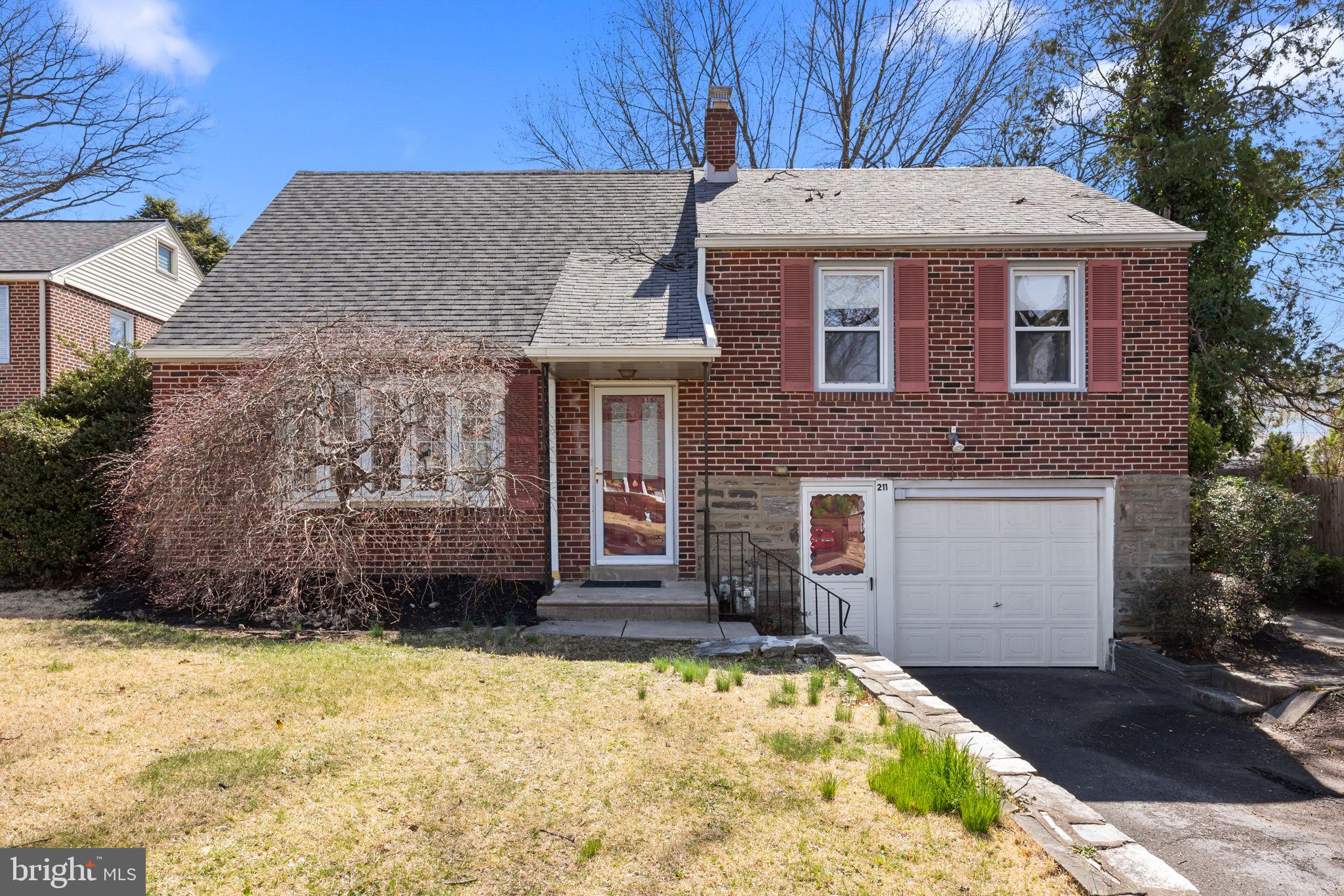 211 Rolling Hill Road Elkins Park, PA 19027 - Photo 1 of 41 a front view of a house with a yard
