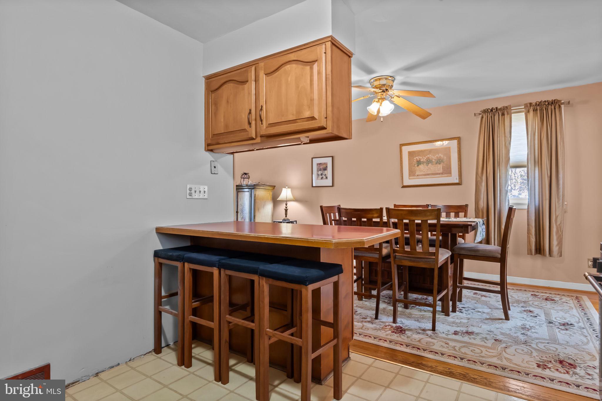211 Rolling Hill Road Elkins Park, PA 19027 - Photo 13 of 41 a view of a dining room with furniture and chandelier