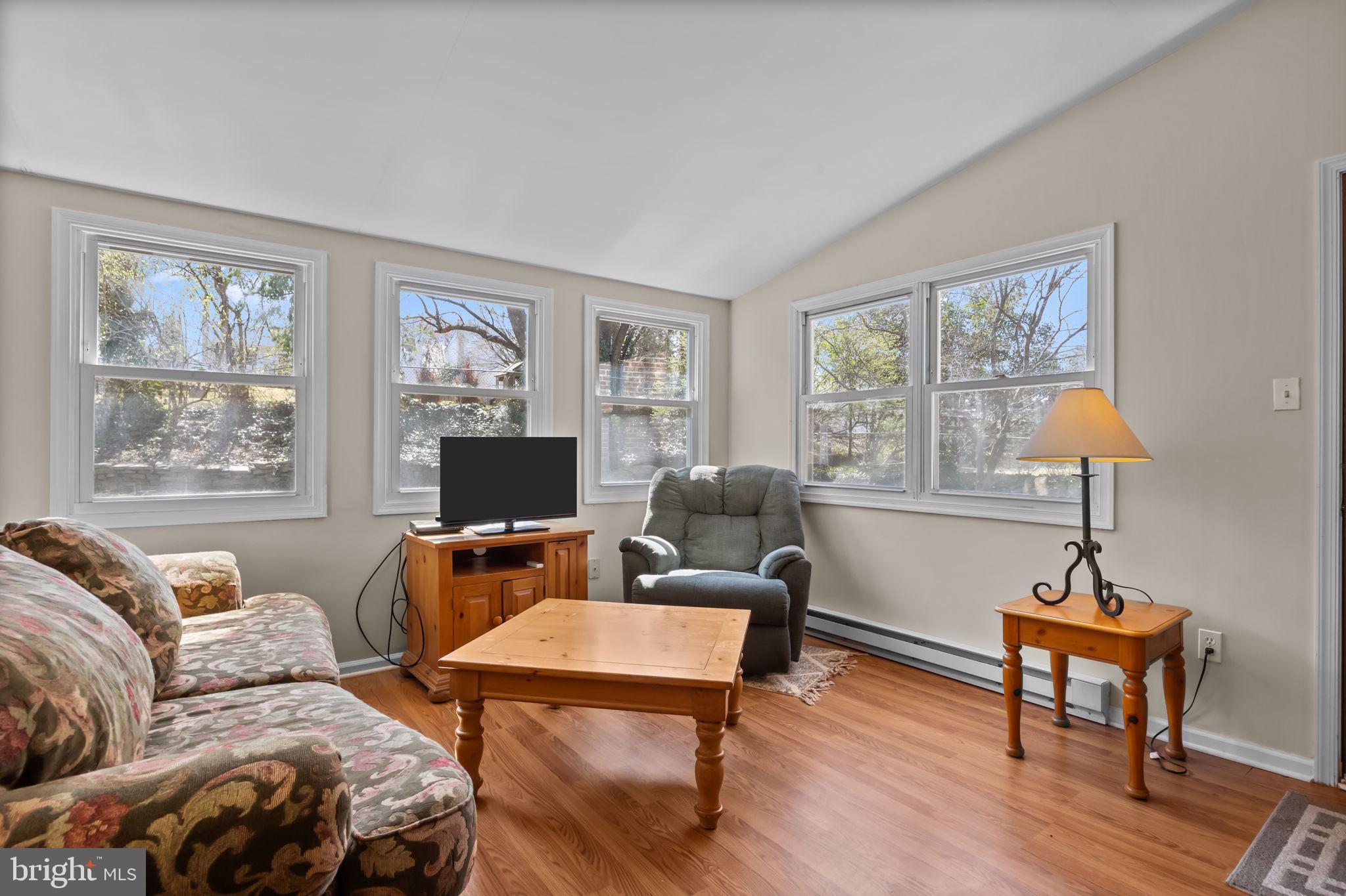 211 Rolling Hill Road Elkins Park, PA 19027 - Photo 16 of 41 a living room with furniture a window and a flat screen tv