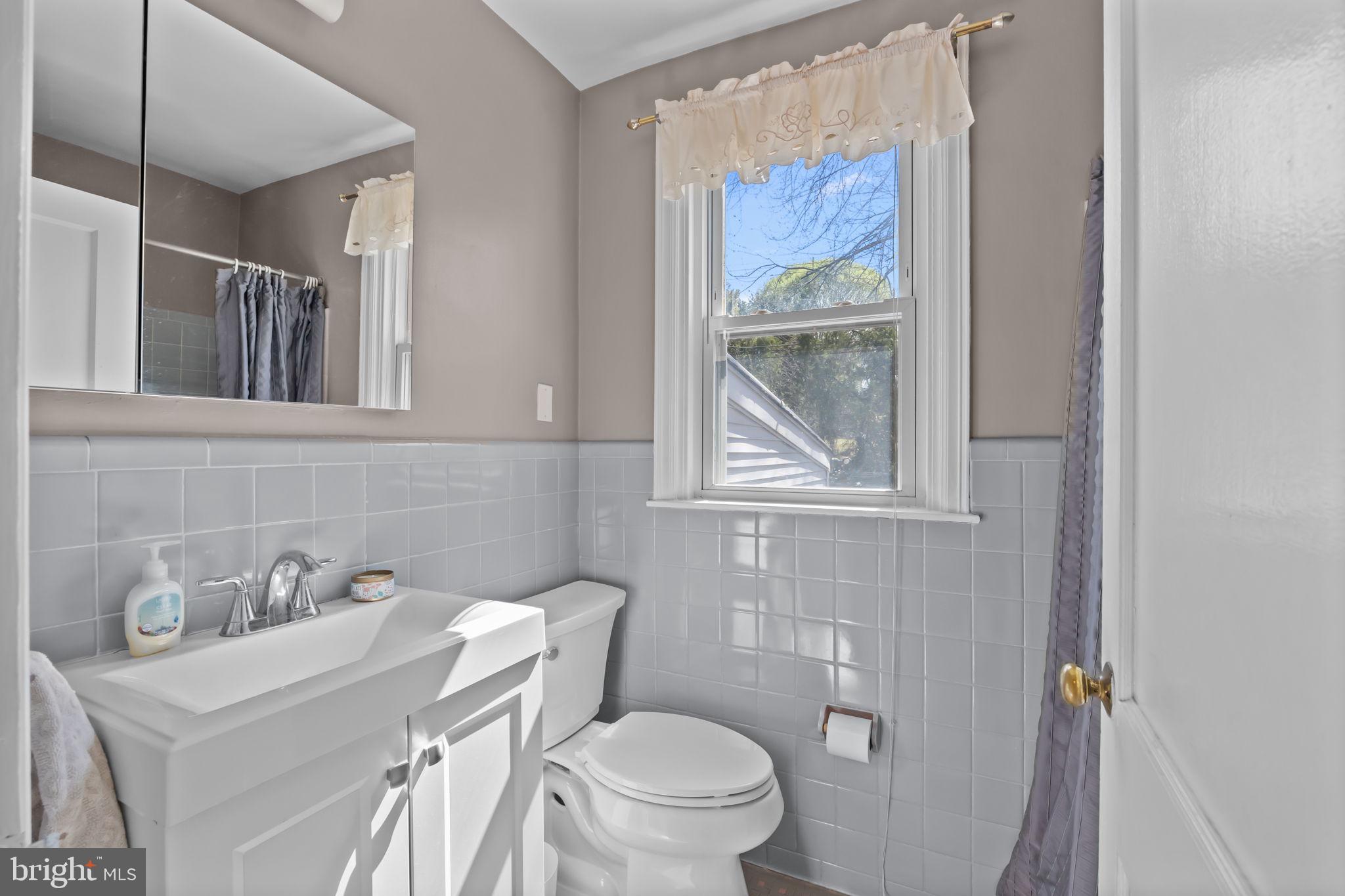 211 Rolling Hill Road Elkins Park, PA 19027 - Photo 20 of 41 a bathroom with a sink and a toilet