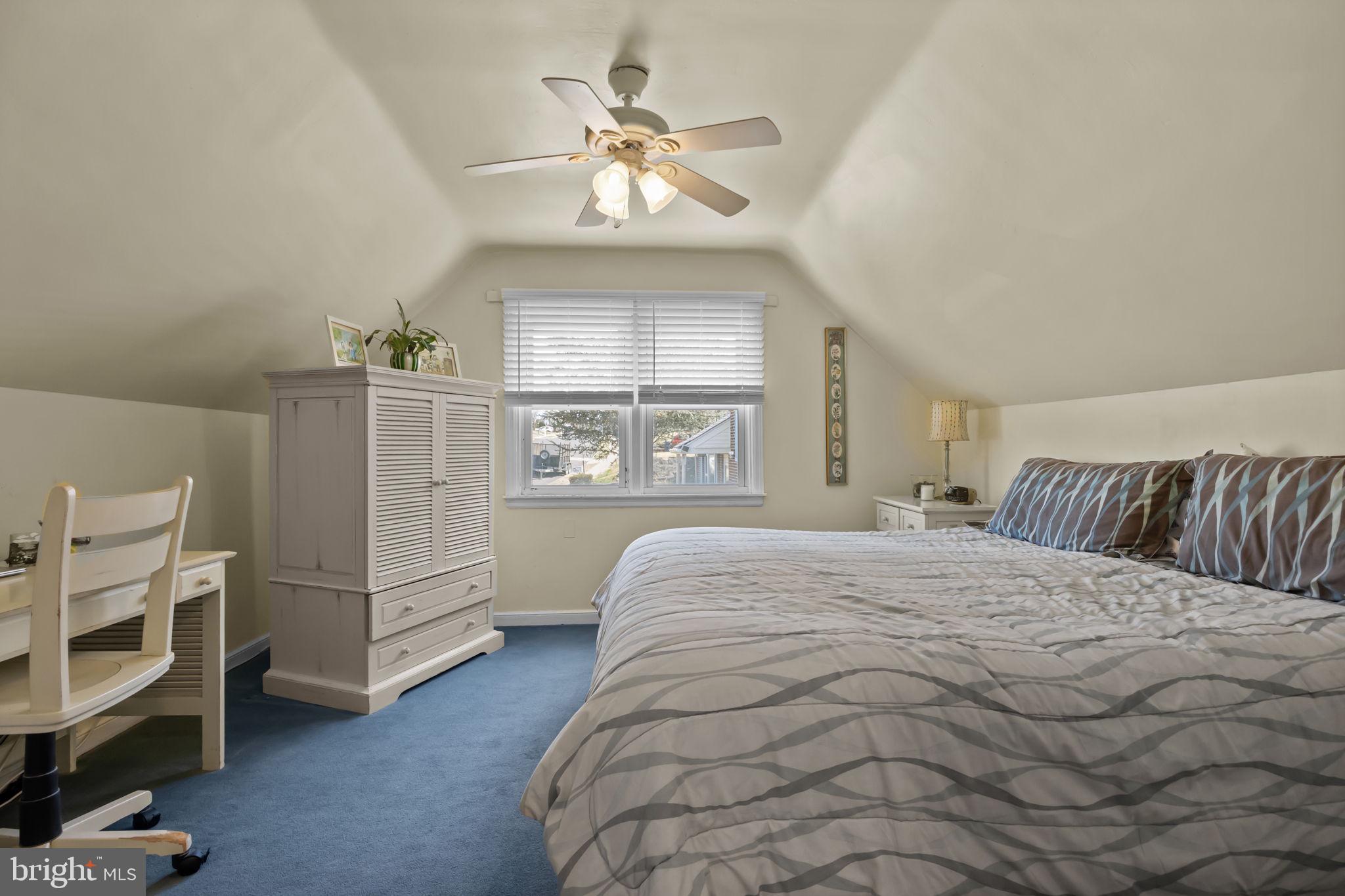 211 Rolling Hill Road Elkins Park, PA 19027 - Photo 22 of 41 a spacious bedroom with a bed and a window