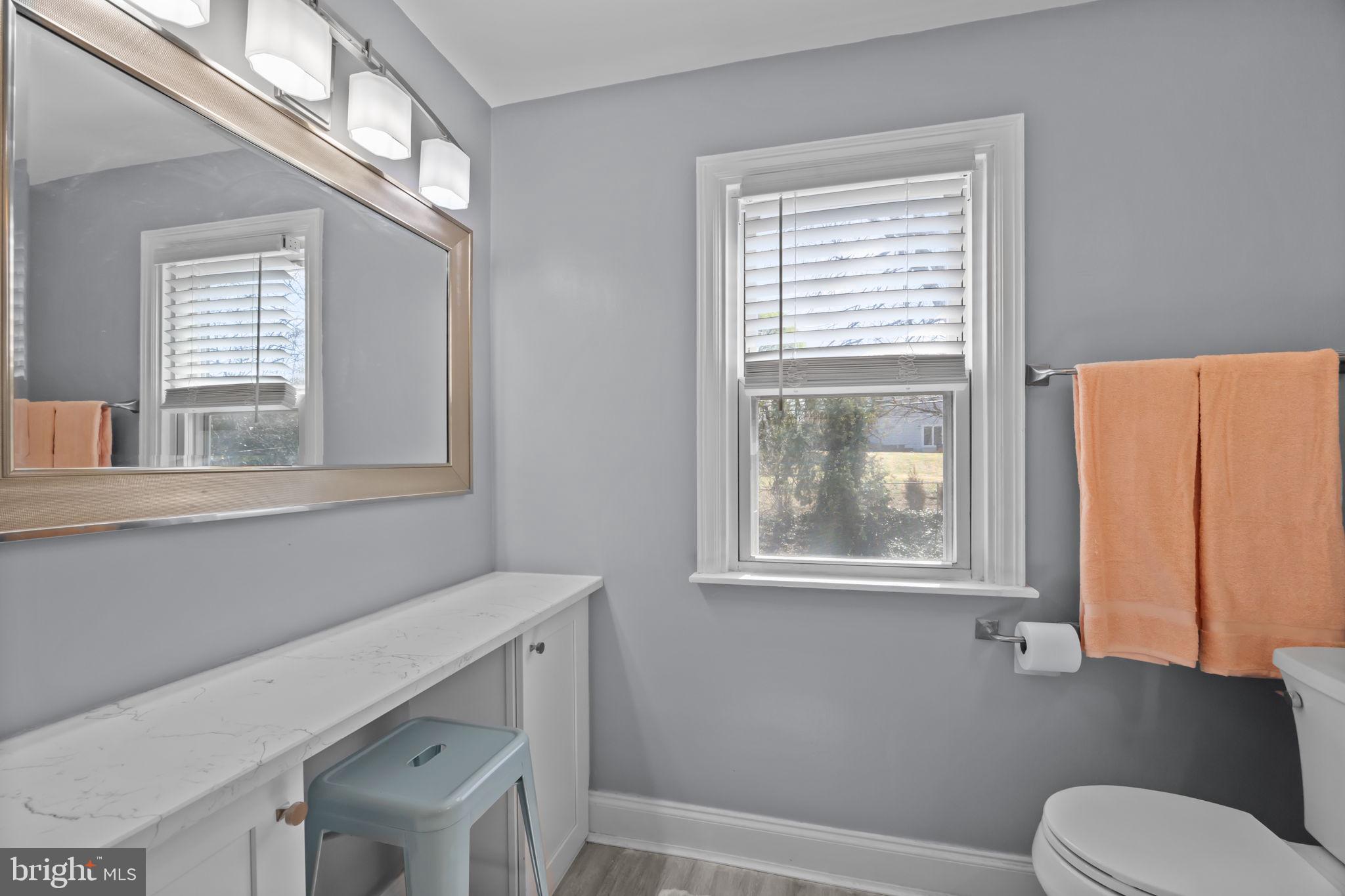 211 Rolling Hill Road Elkins Park, PA 19027 - Photo 27 of 41 a bathroom with a window a sink and a toilet