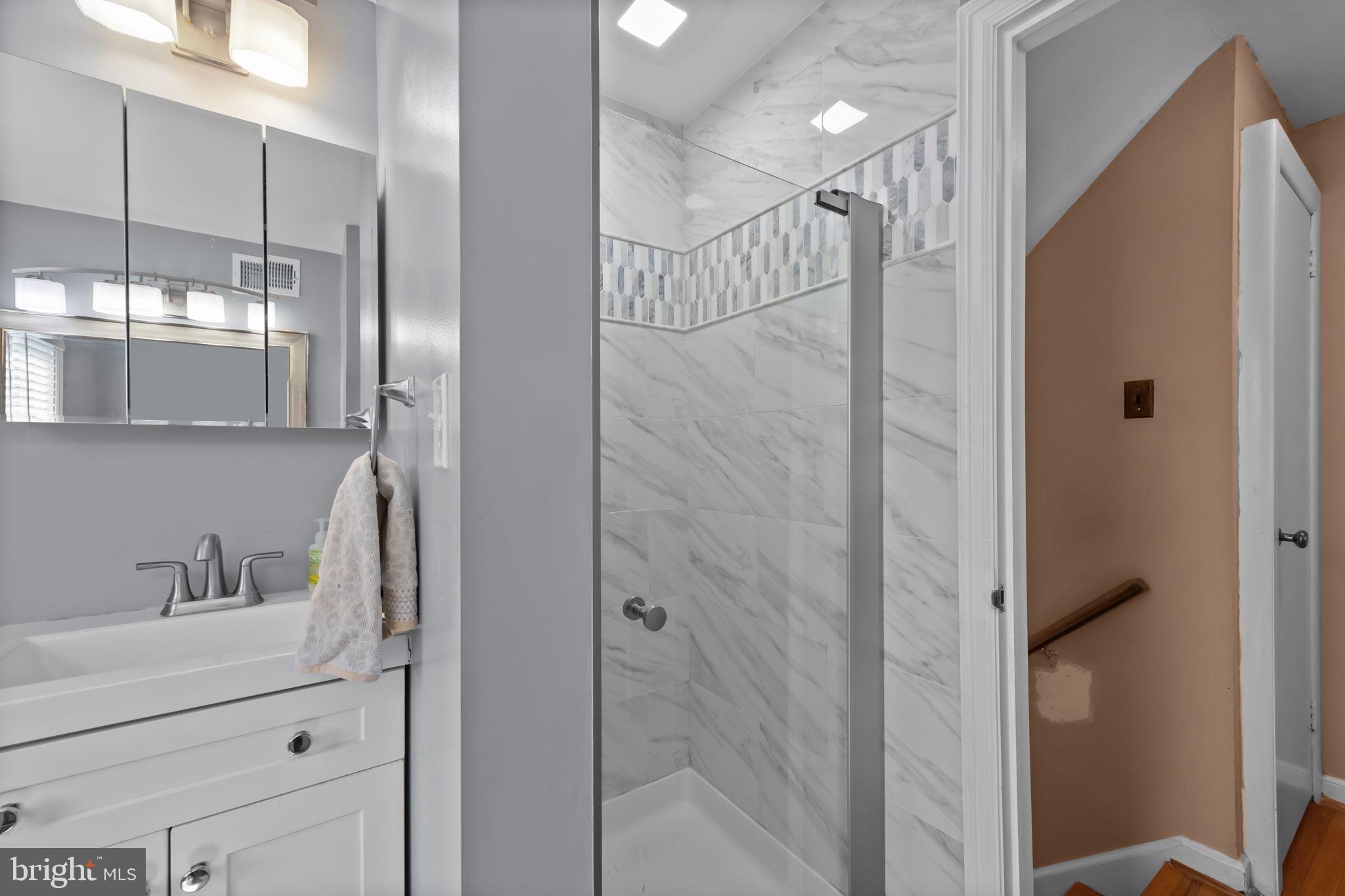 211 Rolling Hill Road Elkins Park, PA 19027 - Photo 28 of 41 a bathroom with a shower and a sink