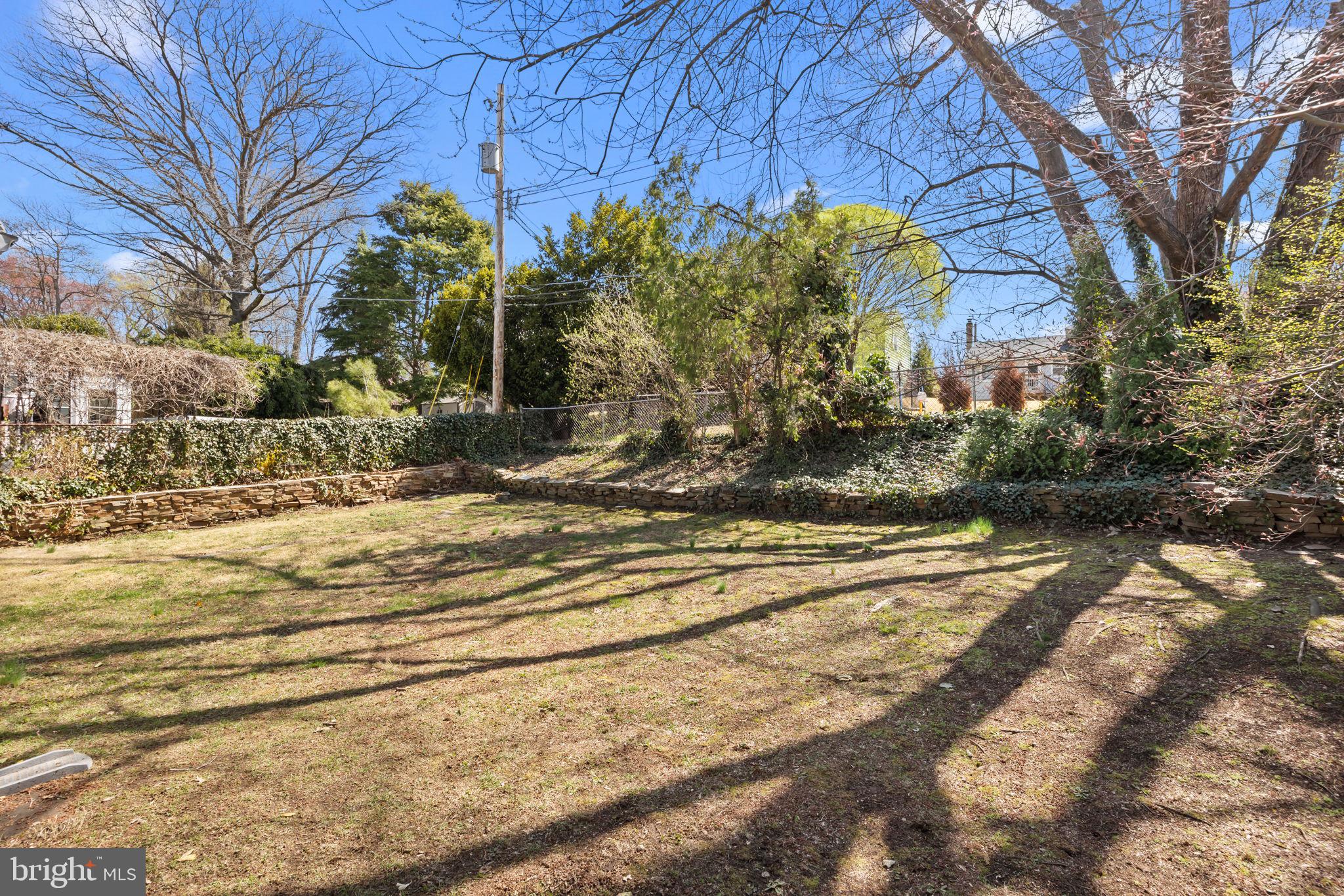 211 Rolling Hill Road Elkins Park, PA 19027 - Photo 37 of 41 a view of a yard with flower plants
