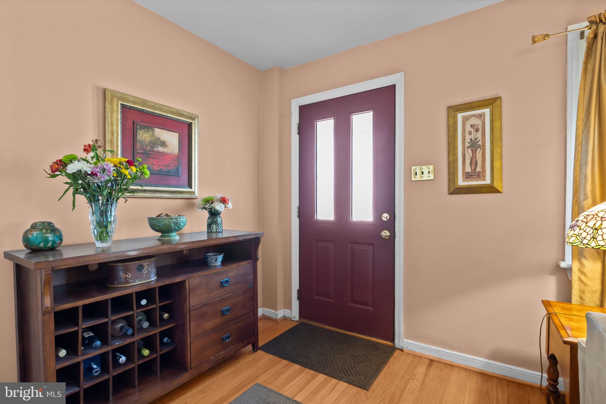 211 Rolling Hill Road Elkins Park, PA 19027 - Photo 5 of 41 a view of a hallway with wooden floor and a potted plant