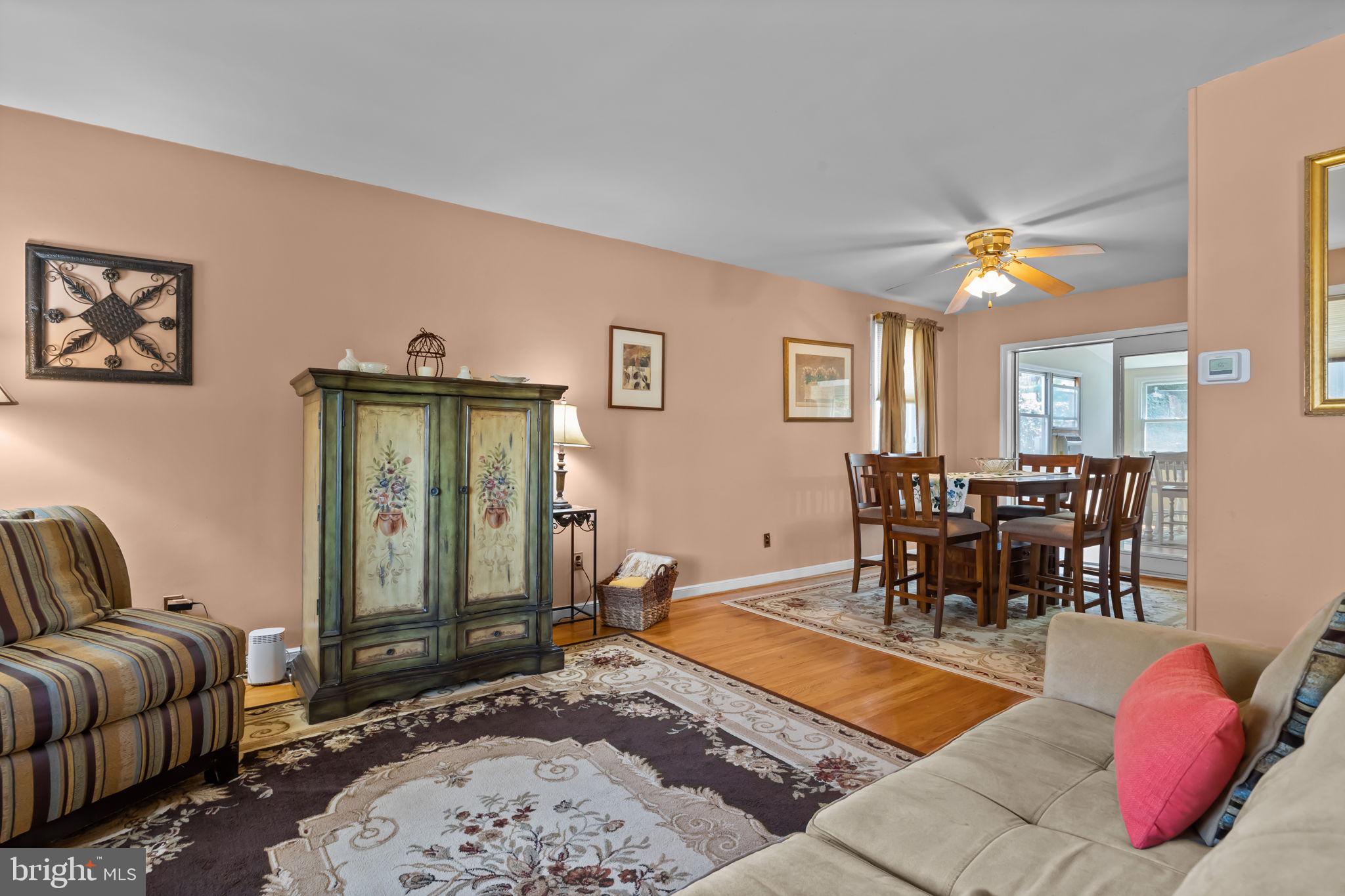 211 Rolling Hill Road Elkins Park, PA 19027 - Photo 6 of 41 a living room with furniture a rug and a chandelier