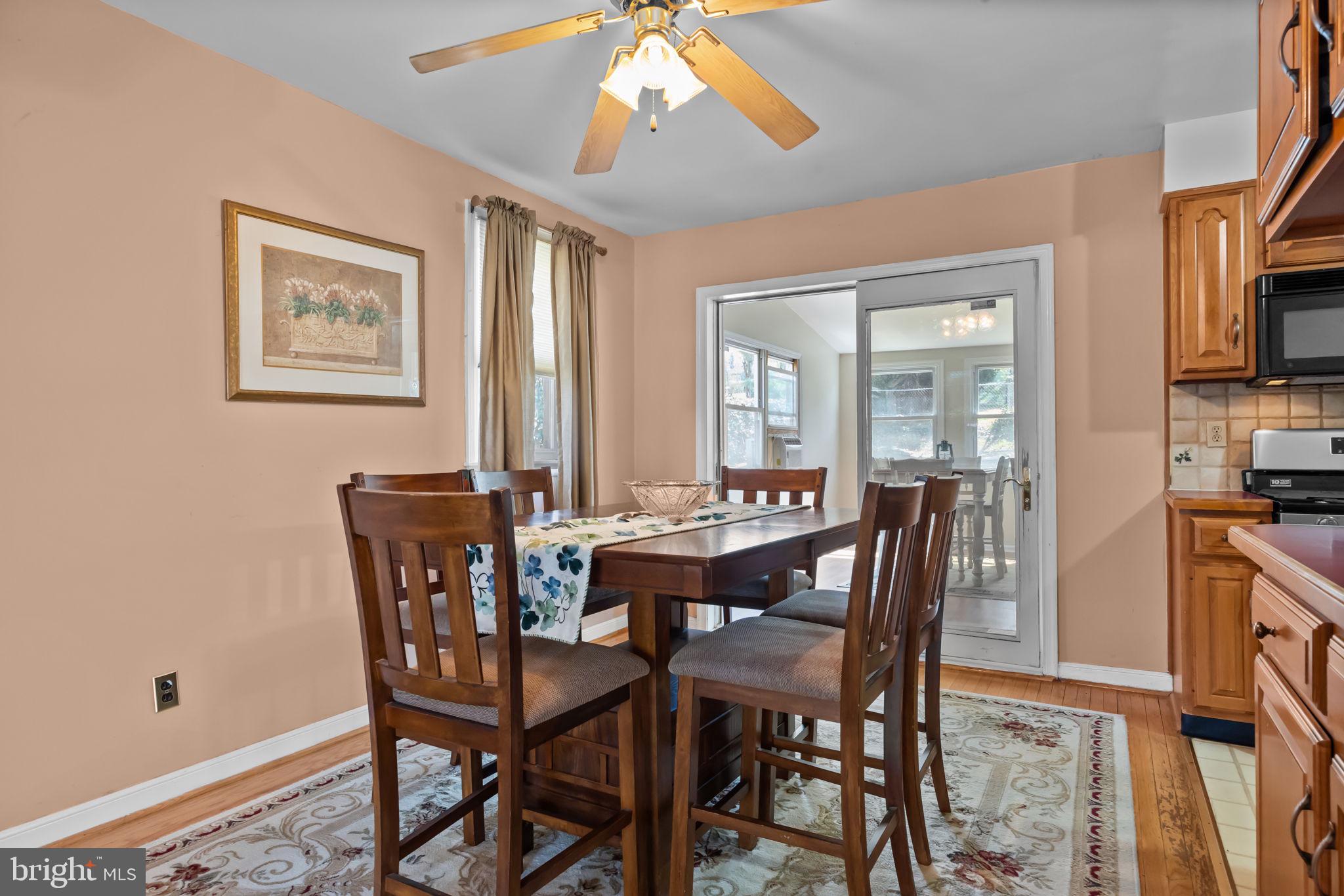 211 Rolling Hill Road Elkins Park, PA 19027 - Photo 9 of 41 a view of a dining room with furniture and a chandelier