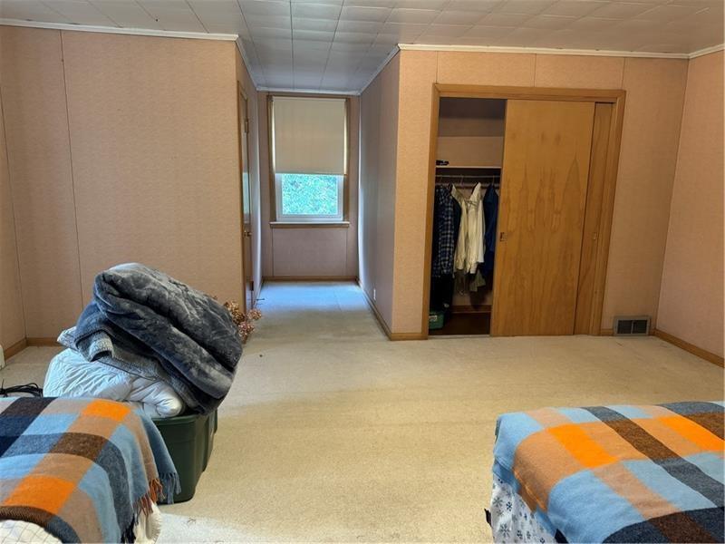 149 South Franklin Street Prospect, PA 16052 - Photo 15 of 25 a view of walk in closet with clothes