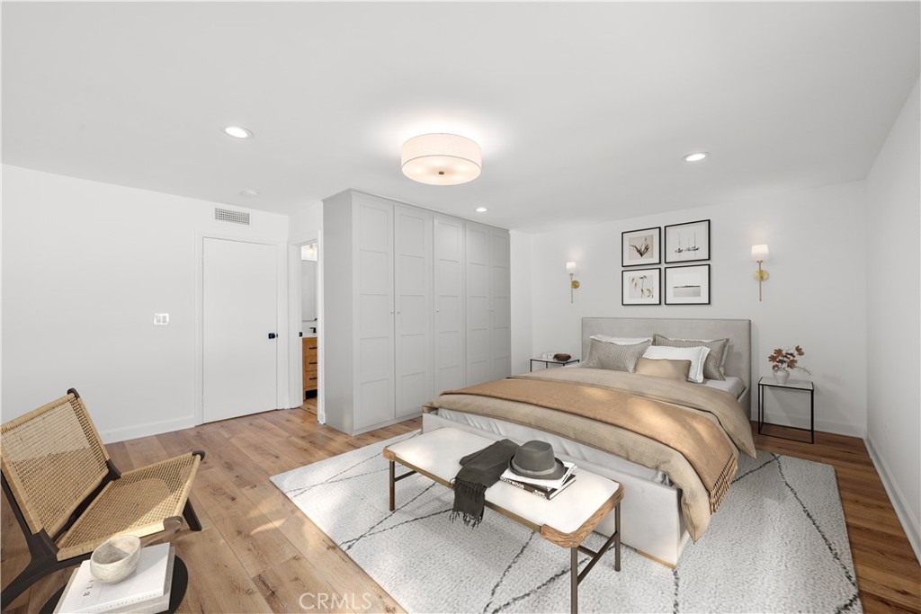 10179 Larwin Avenue, Unit 5 Chatsworth, CA 91311 - Photo 11 of 53 a bed room with a bed and a chair