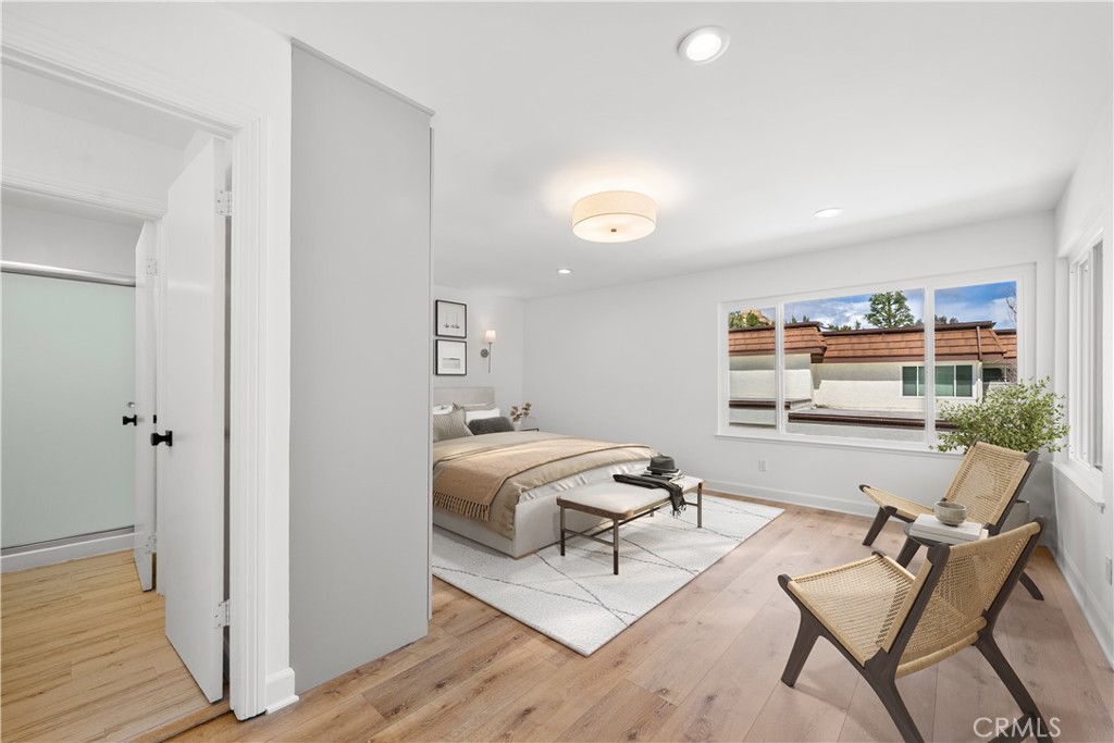 10179 Larwin Avenue, Unit 5 Chatsworth, CA 91311 - Photo 12 of 53 a living room with furniture and a wooden floor