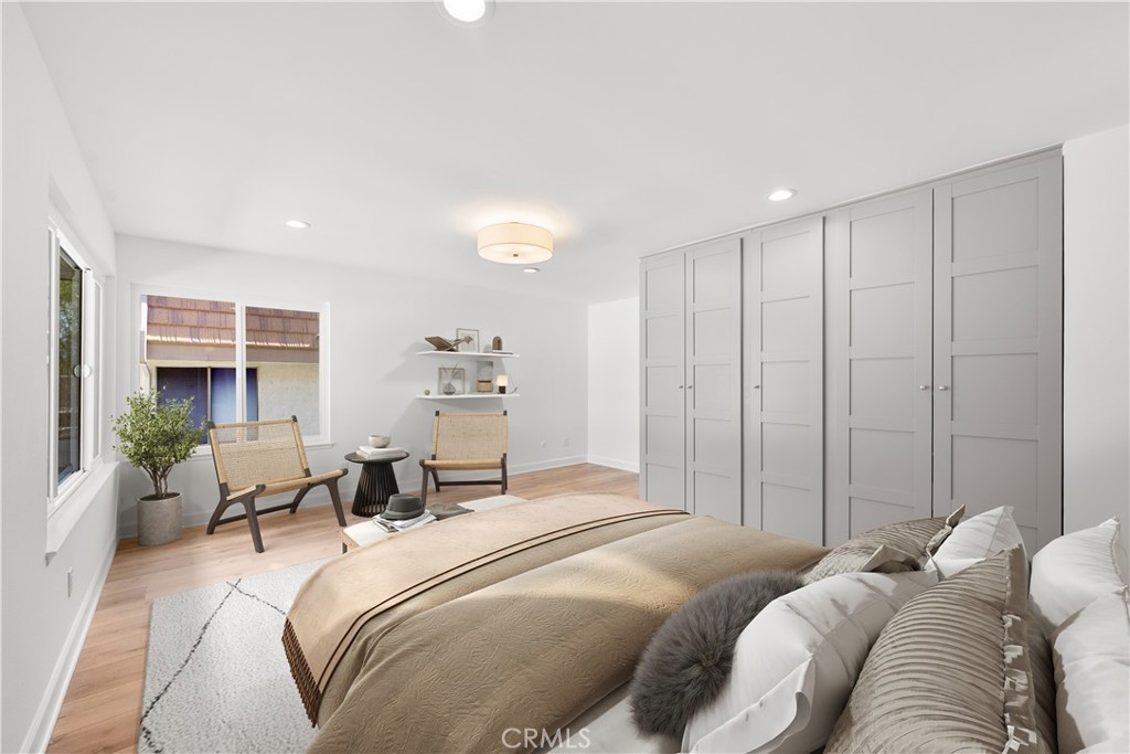 10179 Larwin Avenue, Unit 5 Chatsworth, CA 91311 - Photo 13 of 53 a bedroom with a bed and a couch