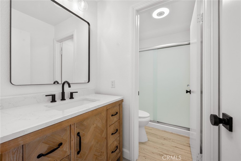 10179 Larwin Avenue, Unit 5 Chatsworth, CA 91311 - Photo 14 of 53 a bathroom with a sink and a mirror