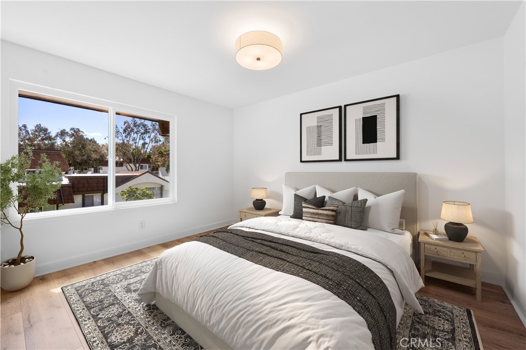 10179 Larwin Avenue, Unit 5 Chatsworth, CA 91311 - Photo 15 of 53 a bedroom with a large bed and a window