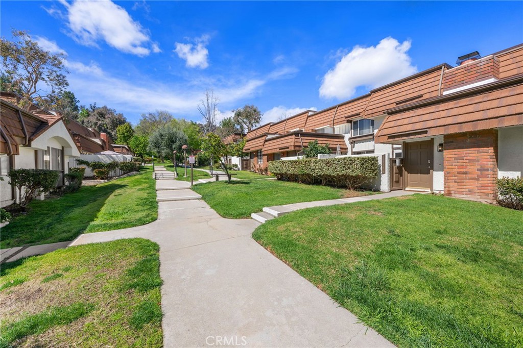 10179 Larwin Avenue, Unit 5 Chatsworth, CA 91311 - Photo 23 of 53 a view of a back yard of the house