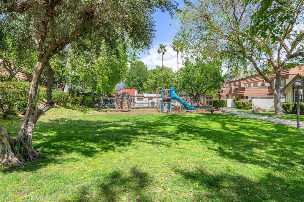 10179 Larwin Avenue, Unit 5 Chatsworth, CA 91311 - Photo 25 of 53 a view of a house with a yard and tree s