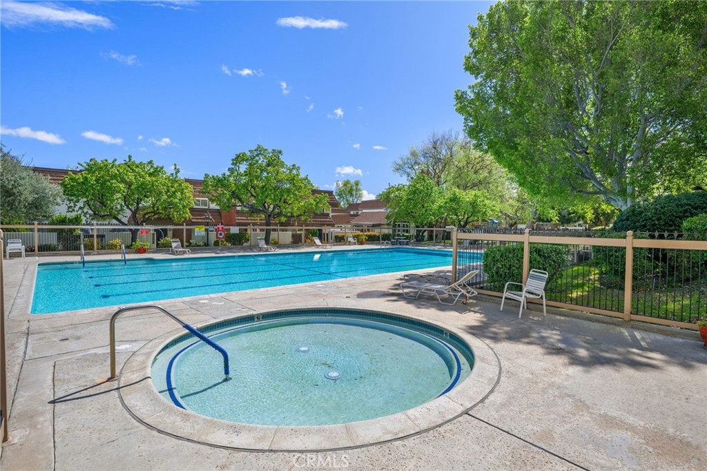 10179 Larwin Avenue, Unit 5 Chatsworth, CA 91311 - Photo 26 of 53 a view of swimming pool with outdoor seating