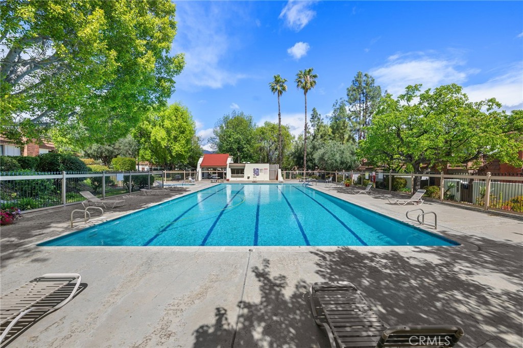 10179 Larwin Avenue, Unit 5 Chatsworth, CA 91311 - Photo 27 of 53 a view of a backyard with wooden floor and seating space