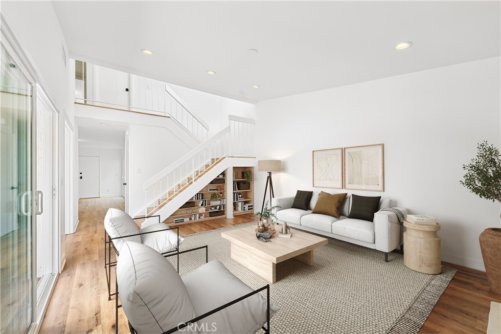 10179 Larwin Avenue, Unit 5 Chatsworth, CA 91311 - Photo 3 of 53 a living room with furniture and wooden floor