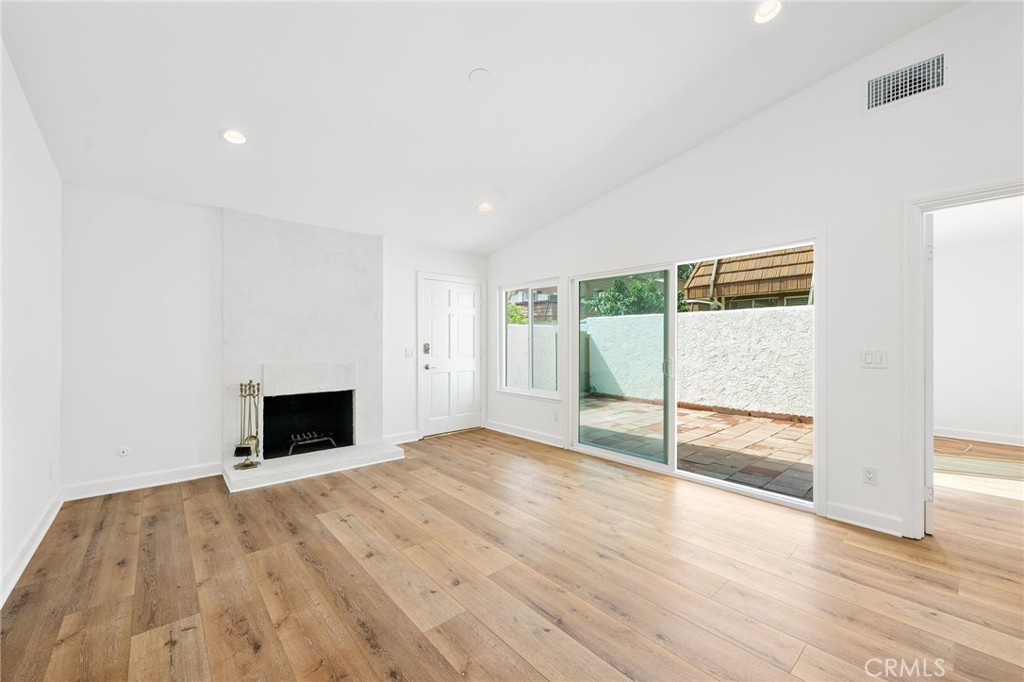 10179 Larwin Avenue, Unit 5 Chatsworth, CA 91311 - Photo 39 of 53 a view of empty room with wooden floor