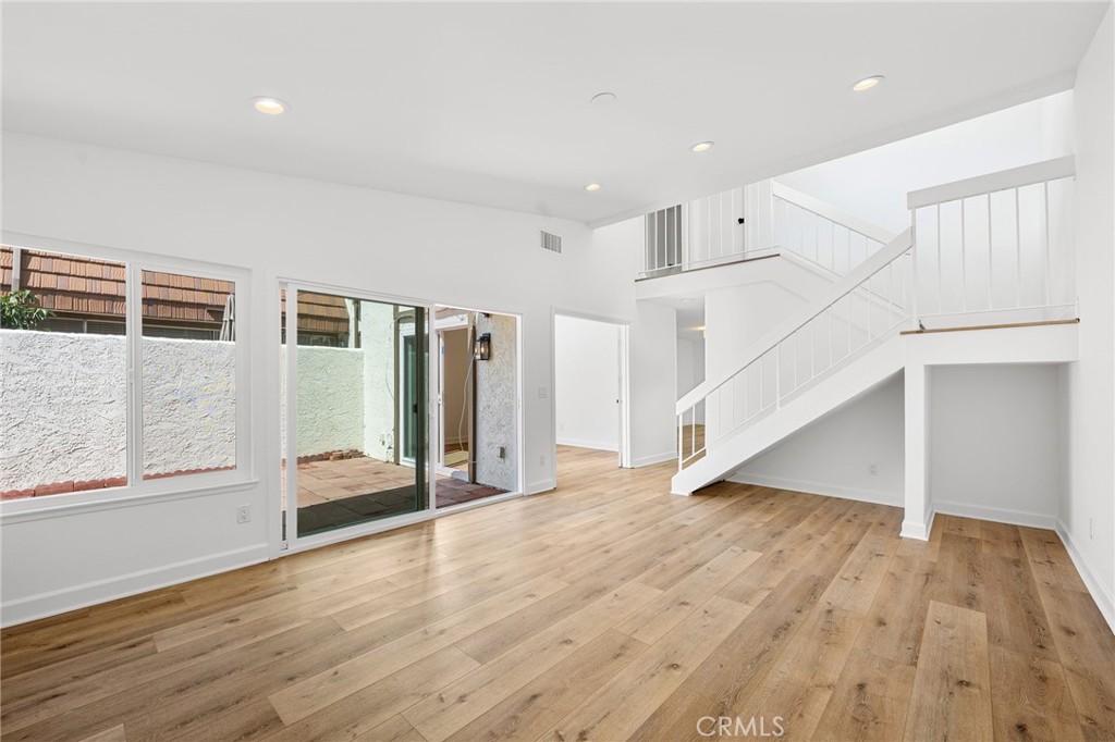 10179 Larwin Avenue, Unit 5 Chatsworth, CA 91311 - Photo 40 of 53 a view of entryway with wooden floor and stairs