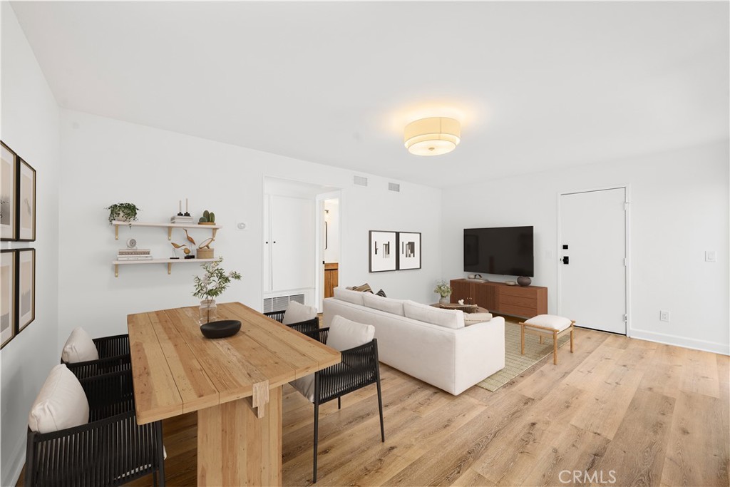 10179 Larwin Avenue, Unit 5 Chatsworth, CA 91311 - Photo 4 of 53 a living room with furniture and a flat screen tv