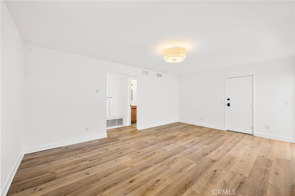 10179 Larwin Avenue, Unit 5 Chatsworth, CA 91311 - Photo 43 of 53 a view of empty room with wooden floor