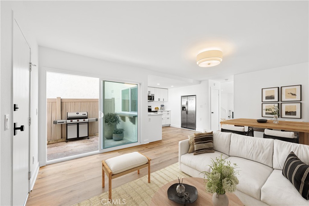 10179 Larwin Avenue, Unit 5 Chatsworth, CA 91311 - Photo 5 of 53 a living room with furniture and wooden floor