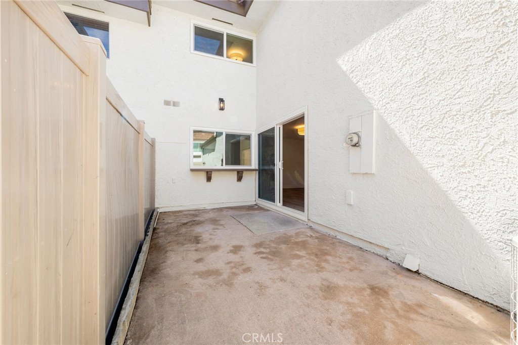 10179 Larwin Avenue, Unit 5 Chatsworth, CA 91311 - Photo 51 of 53 a view of a hallway with wooden floor and staircase