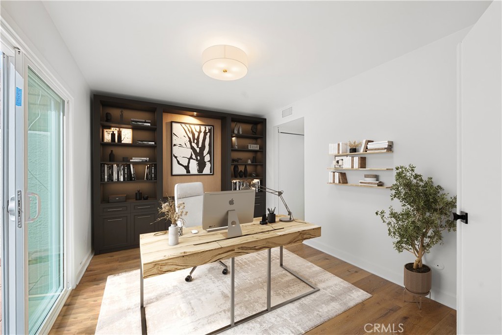 10179 Larwin Avenue, Unit 5 Chatsworth, CA 91311 - Photo 8 of 53 a living room with furniture and a potted plant