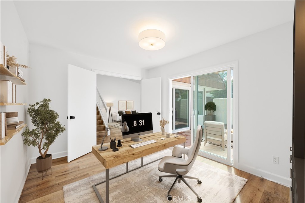 10179 Larwin Avenue, Unit 5 Chatsworth, CA 91311 - Photo 9 of 53 a living room with furniture and a potted plant