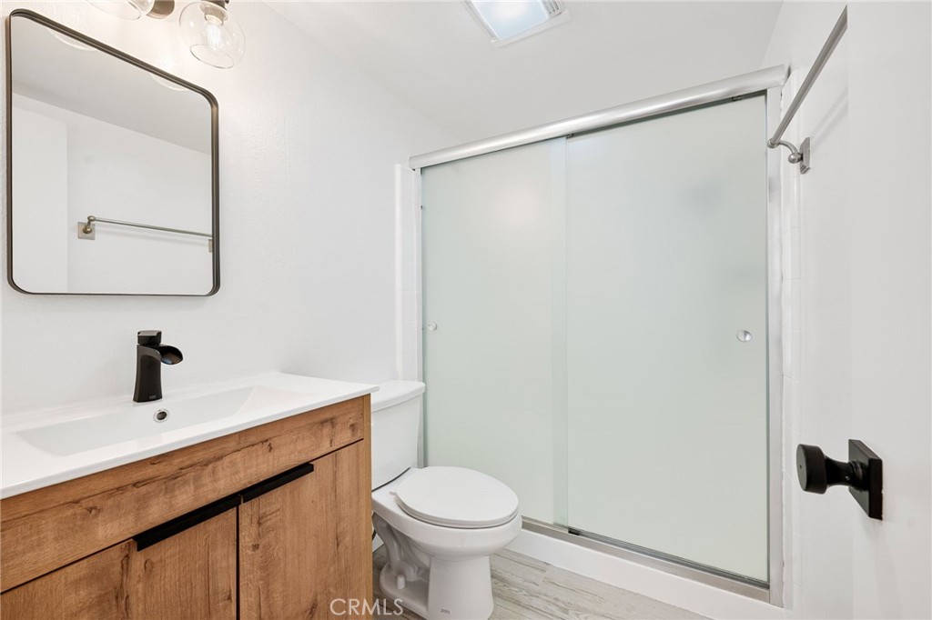 10179 Larwin Avenue, Unit 5 Chatsworth, CA 91311 - Photo 10 of 53 a bathroom with a sink toilet and shower