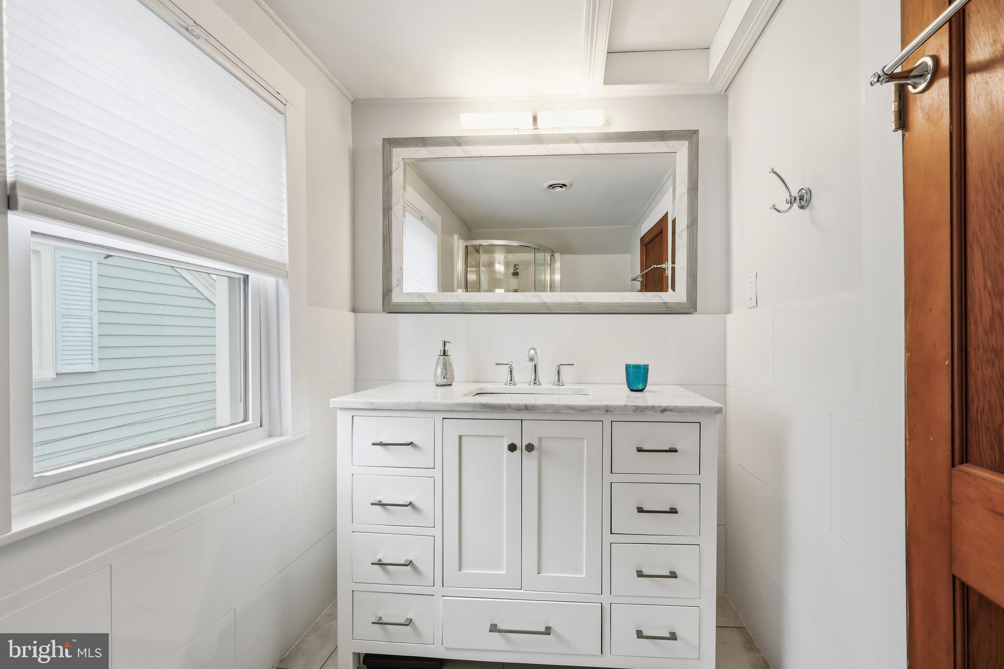 207 Crusader Road Cambridge, MD 21613 - Photo 60 of 76 a view of cabinets a sink and dishwasher with wooden floor