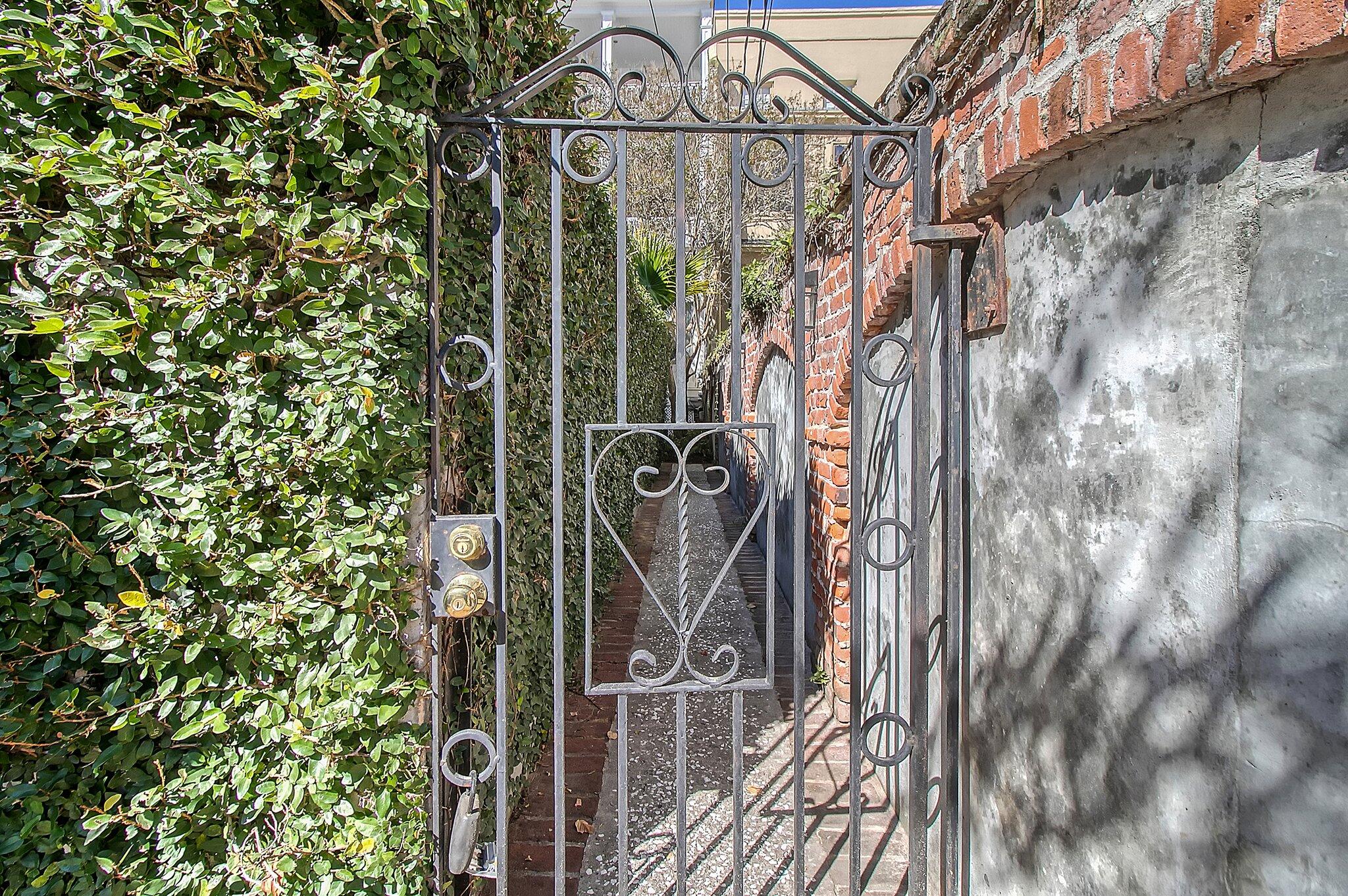 105 Bull Street, Unit A Charleston, SC 29401 - Photo 2 of 45 Back garden original wall