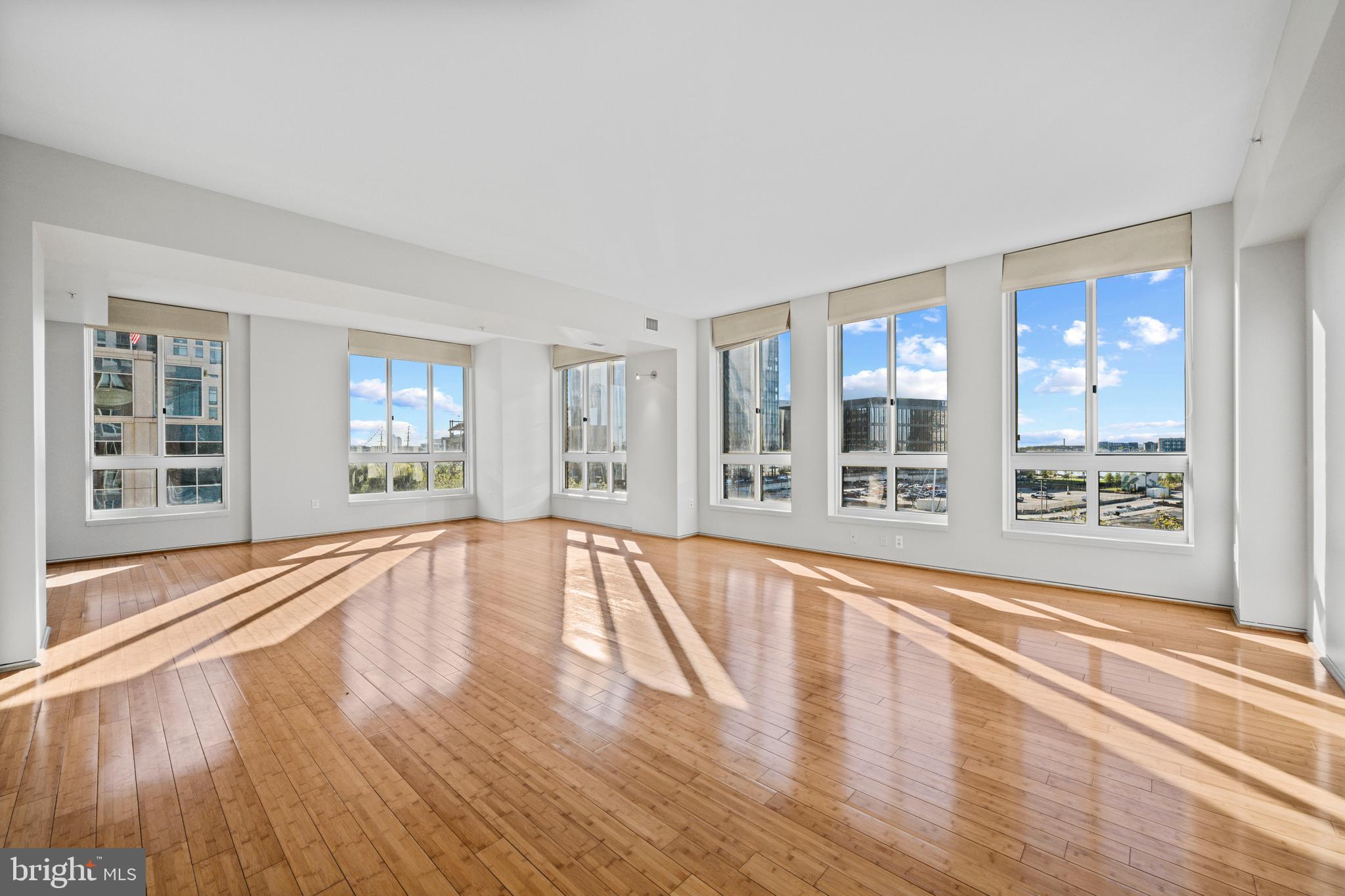 717 President Street, Unit 504 Baltimore, MD 21202 - Photo 1 of 29 a view of an empty room with wooden floor and a window