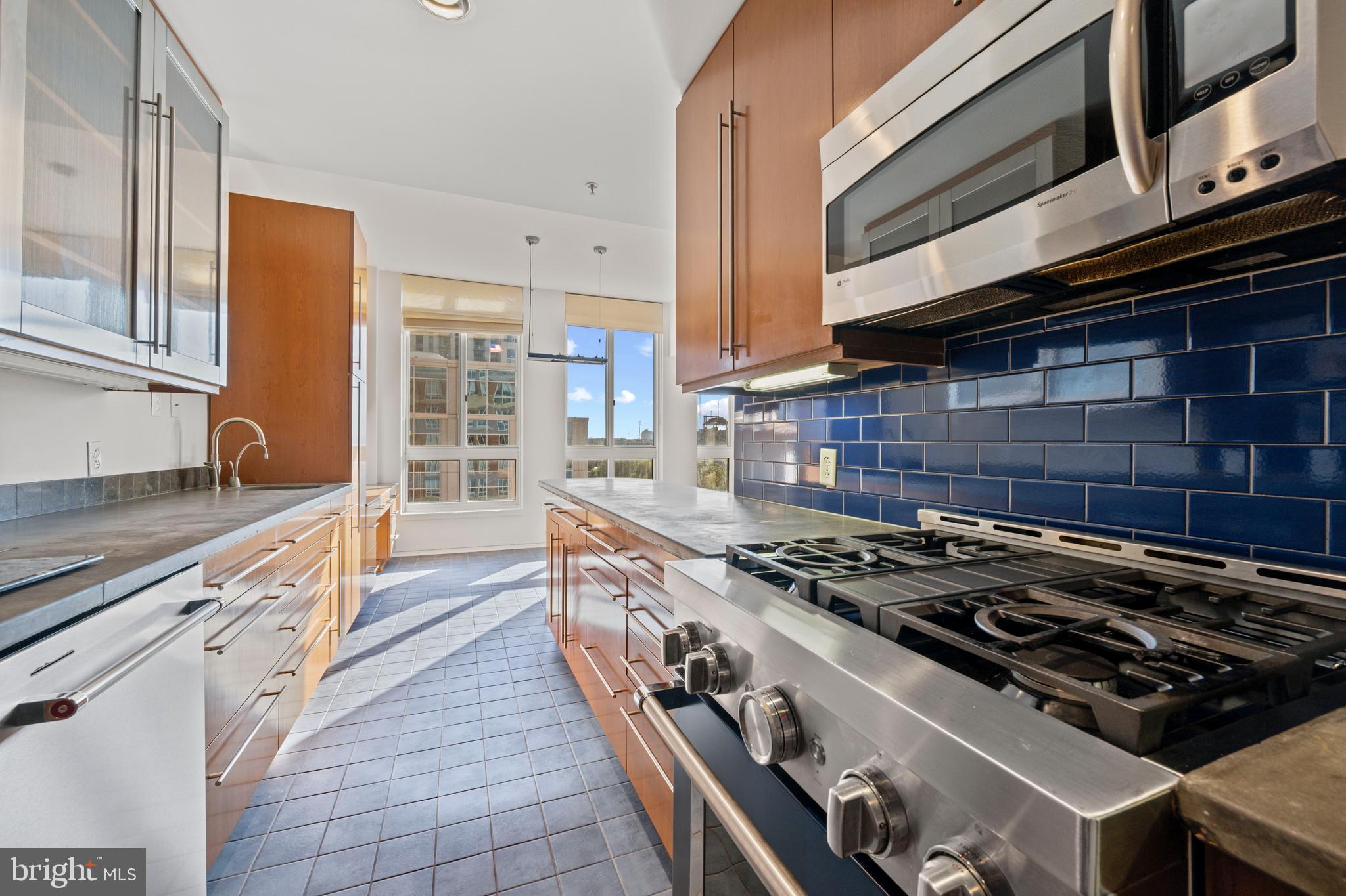 717 President Street, Unit 504 Baltimore, MD 21202 - Photo 13 of 29 a kitchen with stove and cabinets