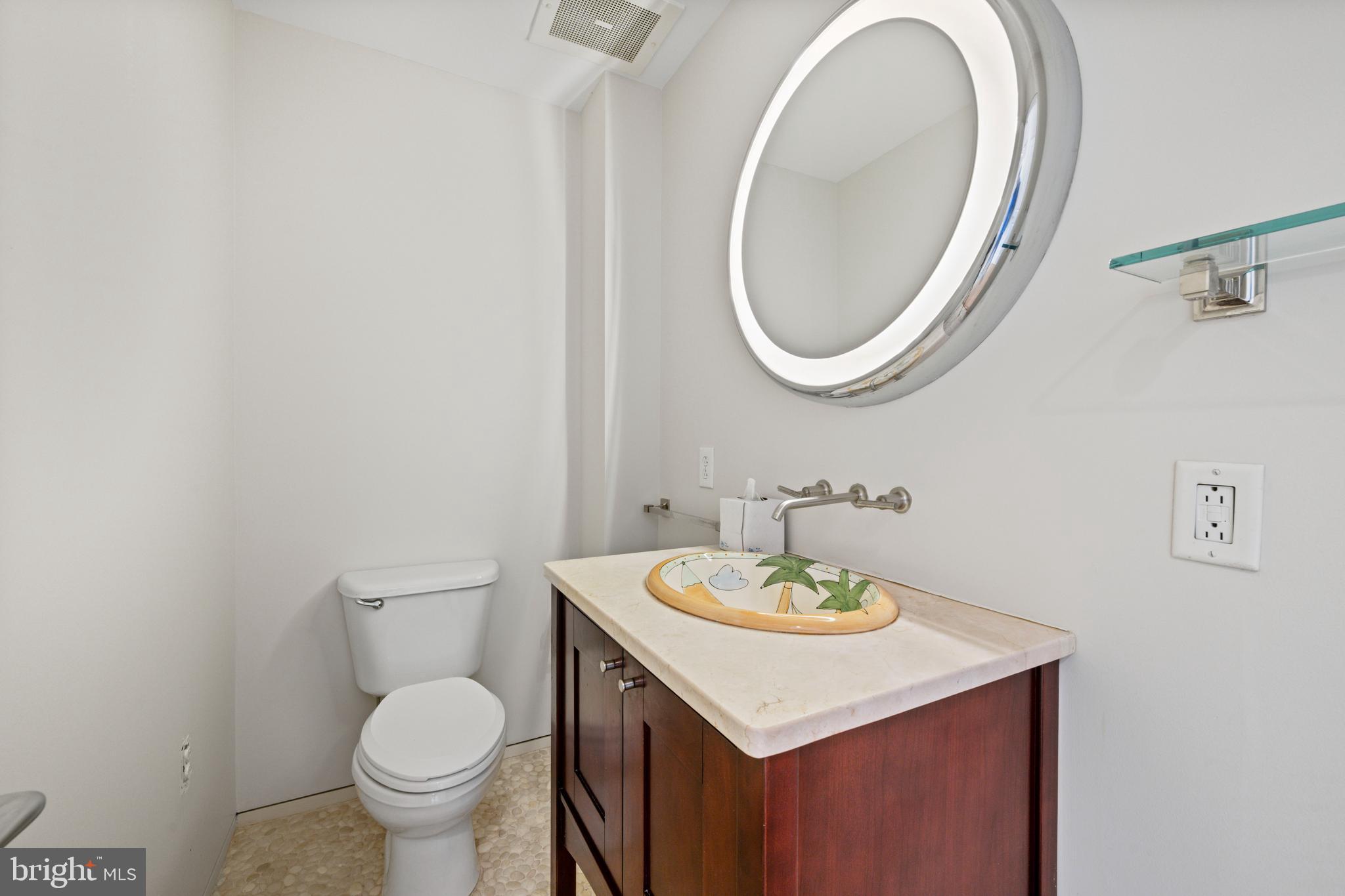 717 President Street, Unit 504 Baltimore, MD 21202 - Photo 14 of 29 a bathroom with a sink and a mirror