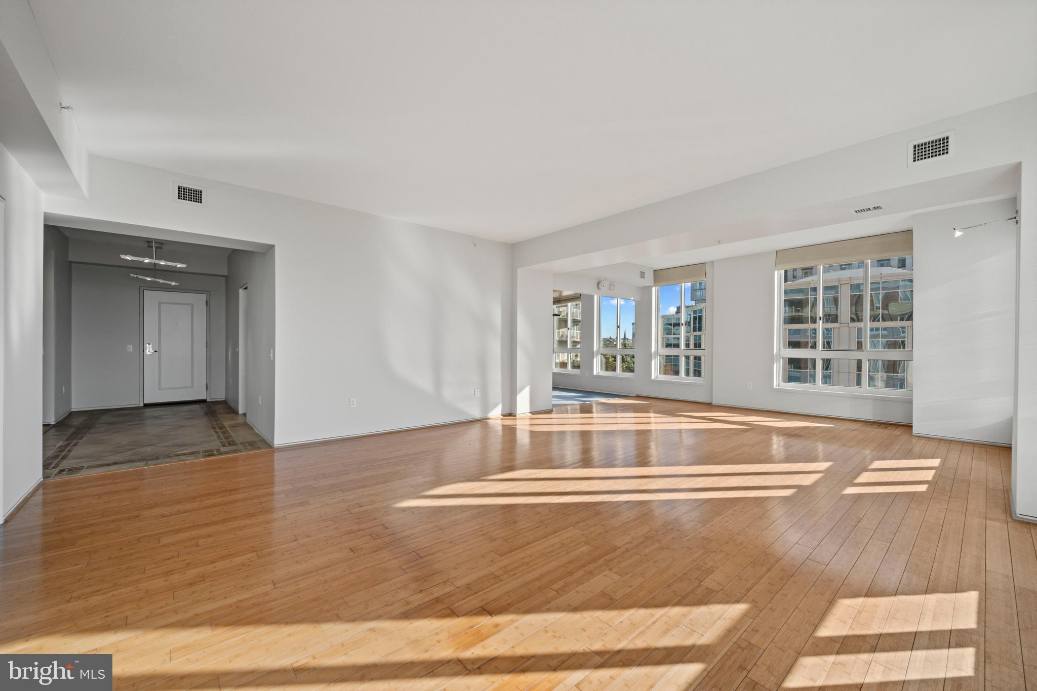 717 President Street, Unit 504 Baltimore, MD 21202 - Photo 16 of 29 a view of an empty room with wooden floor and a window