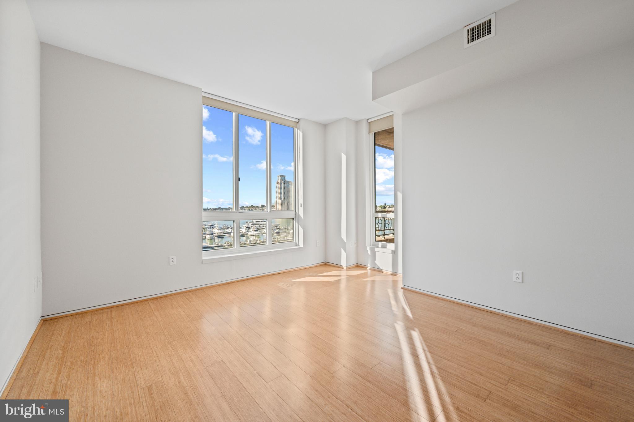 717 President Street, Unit 504 Baltimore, MD 21202 - Photo 17 of 29 a view of an empty room with window and wooden floor