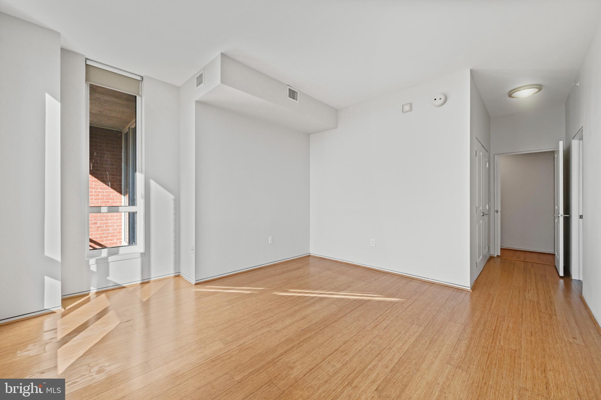 717 President Street, Unit 504 Baltimore, MD 21202 - Photo 20 of 29 a view of empty room with wooden floor and fan