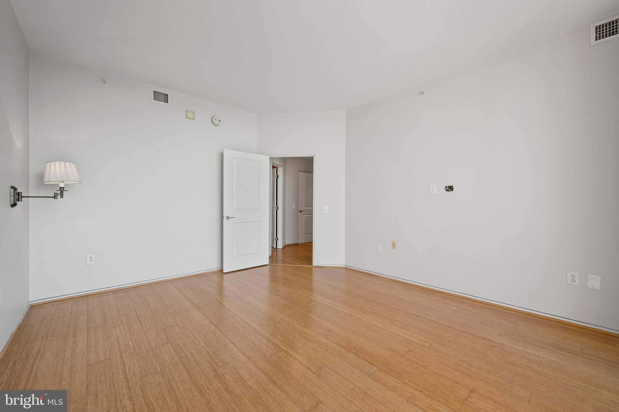 717 President Street, Unit 504 Baltimore, MD 21202 - Photo 23 of 29 a view of an empty room with wooden floor