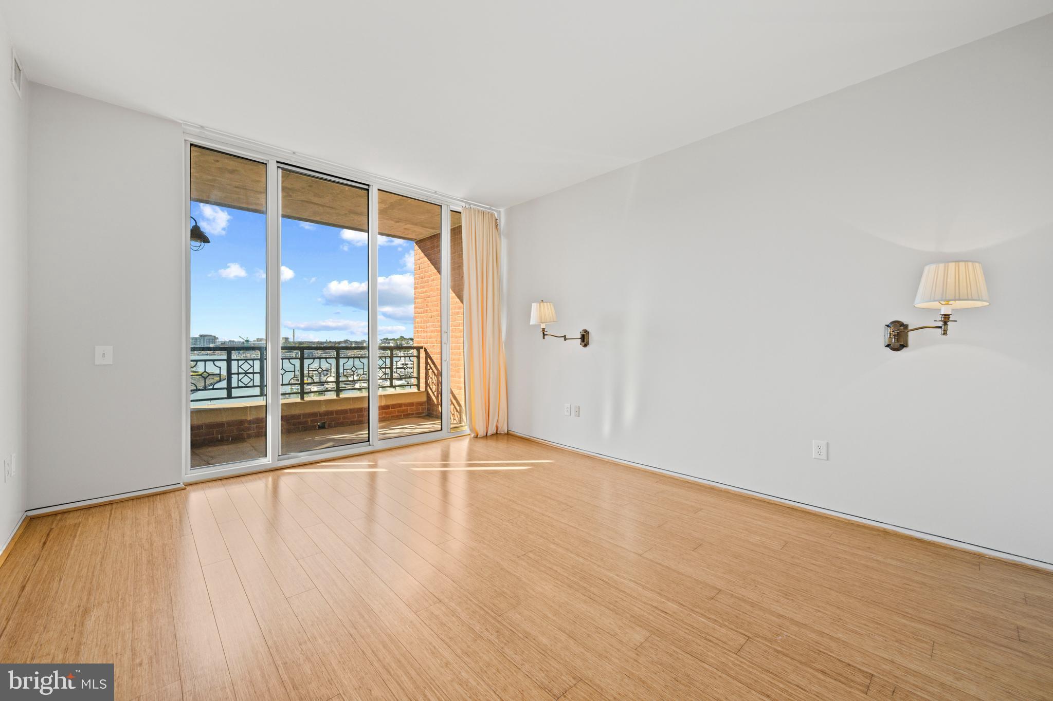 717 President Street, Unit 504 Baltimore, MD 21202 - Photo 26 of 29 wooden floor in an empty room with a window