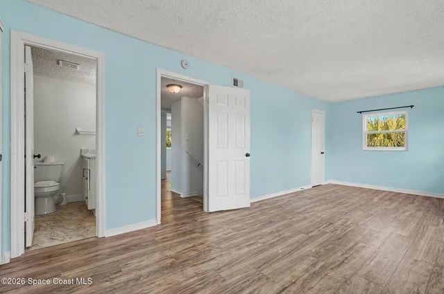 a view of room with bathroom and a bathroom