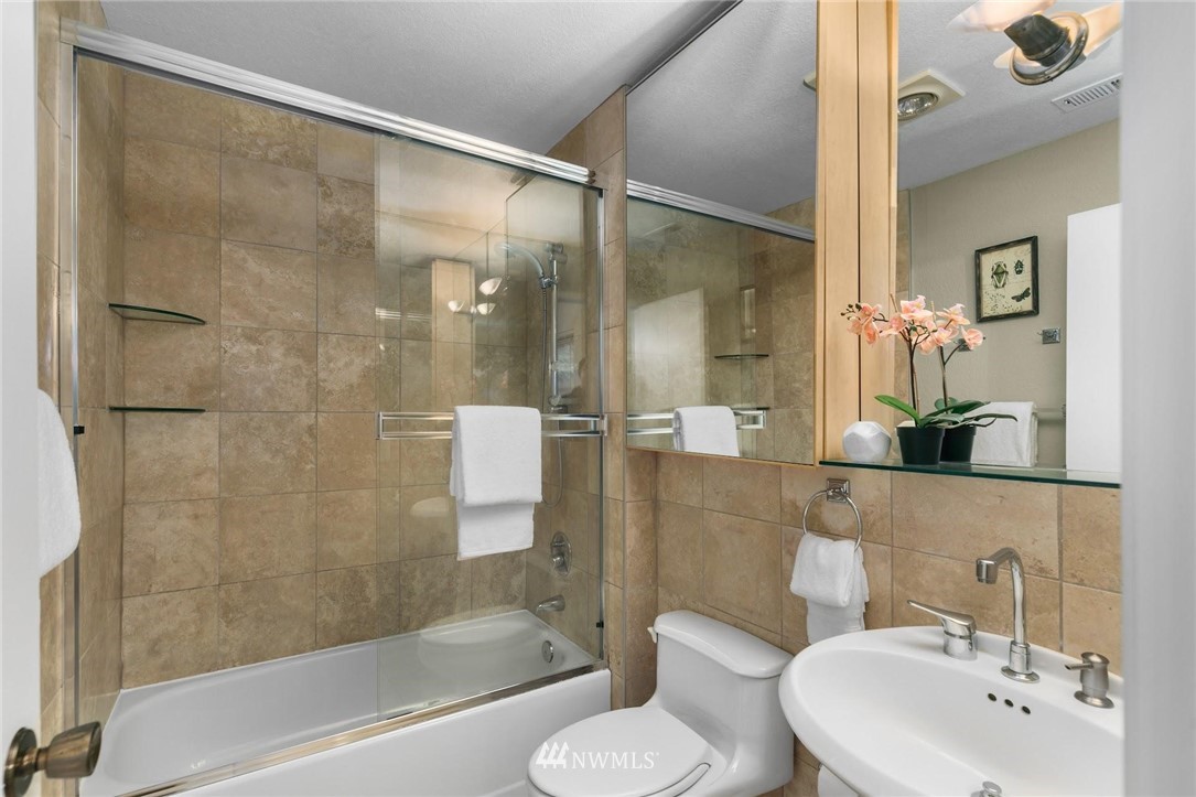 707 Harvest Road Bothell, WA 98012 - Photo 13 of 27 a bathroom with a sink and a mirror