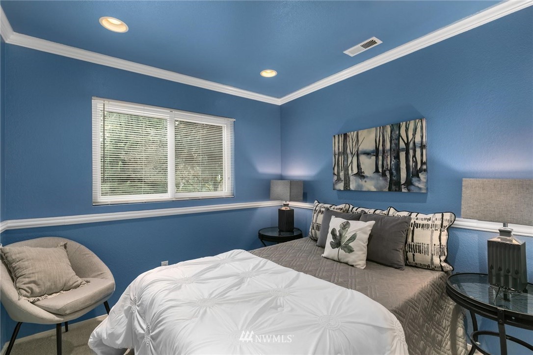 707 Harvest Road Bothell, WA 98012 - Photo 14 of 27 a bedroom with a bed and window