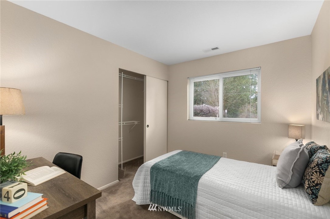 707 Harvest Road Bothell, WA 98012 - Photo 15 of 27 a bedroom with a bed and a window