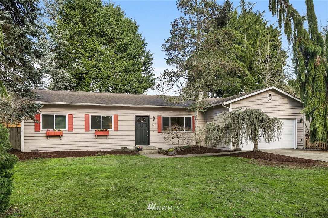 707 Harvest Road Bothell, WA 98012 - Photo 25 of 27 a front view of house with yard and green space